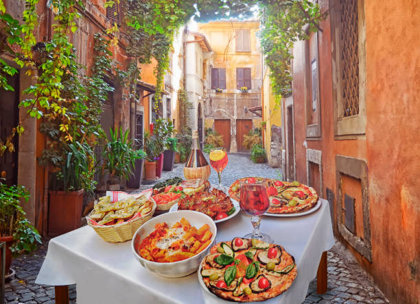 A traditional Italian kitchen setup with ripe vine tomatoes, extra virgin olive oil, fresh basil, and garlic.
