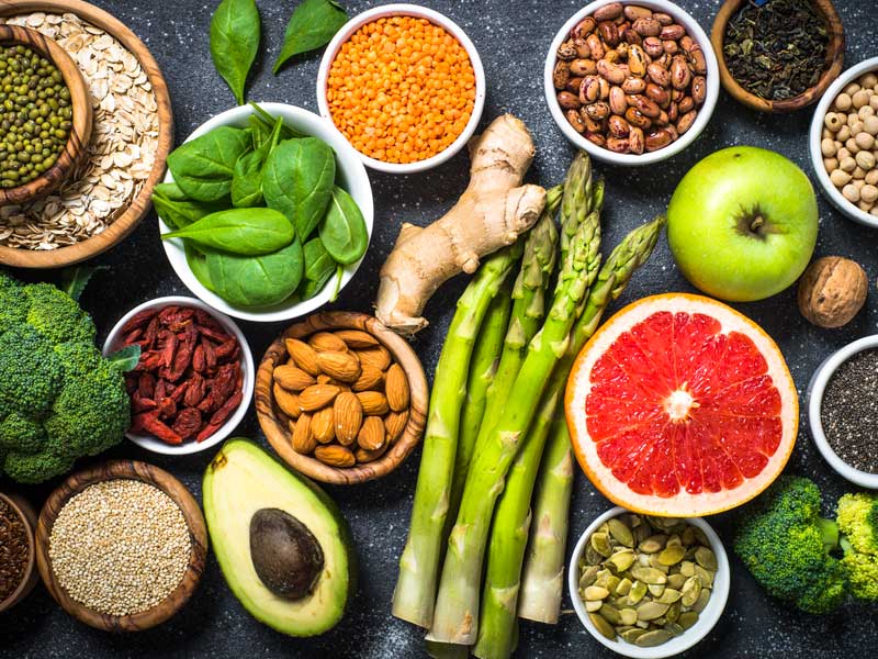 Longevity-promoting superfoods including olive oil, berries, and leafy greens